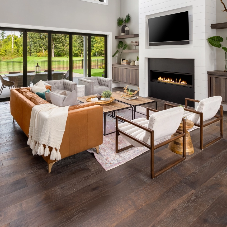 A living room with wood floors and furniture.