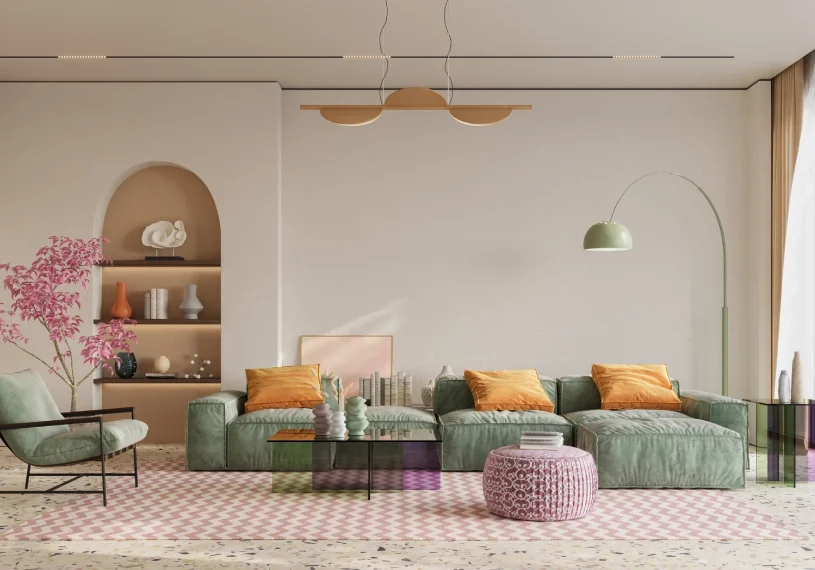 A living room with green furniture and pink rug.